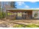 Spacious barn featuring stalls and ample outdoor area, great for horses or other animals at 1008 Hoodtown Rd, Bonneau, SC 29431