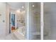 Spacious bathroom with a jetted tub, glass shower, and neutral tile at 1008 Hoodtown Rd, Bonneau, SC 29431