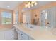 Bathroom featuring a vanity with a long mirror, white cabinets, and sink at 1008 Hoodtown Rd, Bonneau, SC 29431