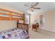 Bedroom featuring a bunk bed, ceiling fan, and a view into the ensuite bathroom at 1008 Hoodtown Rd, Bonneau, SC 29431