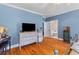Bedroom view showcasing stylish dressers and a glimpse into an adjoining bathroom at 1008 Hoodtown Rd, Bonneau, SC 29431