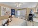 Bedroom featuring a full bed, ceiling fan, and an attached office space at 1008 Hoodtown Rd, Bonneau, SC 29431