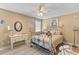 Bedroom with decorative bed, ceiling fan, and a window with blinds at 1008 Hoodtown Rd, Bonneau, SC 29431