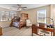 Bright bedroom with a bunk bed, desk, and natural light from two windows at 1008 Hoodtown Rd, Bonneau, SC 29431