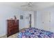 Bedroom with light blue walls, ceiling fan and a view into another room at 1008 Hoodtown Rd, Bonneau, SC 29431