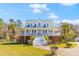 Charming two-story home with a welcoming front porch and well-maintained landscaping at 1008 Hoodtown Rd, Bonneau, SC 29431