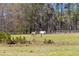 Pastoral scene of horses grazing in lush, fenced pasture land on a scenic estate at 1008 Hoodtown Rd, Bonneau, SC 29431