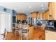 Spacious kitchen featuring wooden cabinets, stainless steel appliances, and an island with bar seating at 1008 Hoodtown Rd, Bonneau, SC 29431
