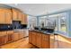 Well-equipped kitchen featuring a stovetop island, ample counter space, and an adjacent dining area at 1008 Hoodtown Rd, Bonneau, SC 29431