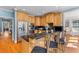 Modern kitchen with wooden cabinetry, stainless steel appliances, and a functional island with barstool seating at 1008 Hoodtown Rd, Bonneau, SC 29431