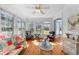 Bright living room with hardwood floors, large windows, and comfortable seating at 1008 Hoodtown Rd, Bonneau, SC 29431