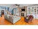 Cozy living room with a brick fireplace, built-in bookshelves, and comfortable seating at 1008 Hoodtown Rd, Bonneau, SC 29431