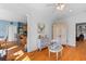 Open-concept living area showcasing hardwood floors, decorative furniture, and access to the kitchen at 1008 Hoodtown Rd, Bonneau, SC 29431