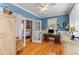 Home office with French doors, a classic desk, and bright, natural lighting at 1008 Hoodtown Rd, Bonneau, SC 29431