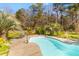 Beautifully maintained backyard pool surrounded by mature landscaping, great for outdoor entertaining at 1008 Hoodtown Rd, Bonneau, SC 29431