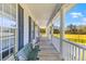 Spacious porch featuring a bench and elegant columns, offering serene outdoor relaxation at 1008 Hoodtown Rd, Bonneau, SC 29431