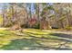 A wooden shed surrounded by mature trees in a large lawn at 1008 Hoodtown Rd, Bonneau, SC 29431