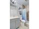 Charming bathroom featuring a gray vanity, a framed mirror, and a tub-shower with patterned curtain at 1014 Bradbury Ln, Charleston, SC 29492