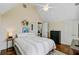Inviting bedroom showcasing wood floors, neutral walls, a ceiling fan, and comfortable bedding at 1014 Bradbury Ln, Charleston, SC 29492