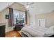 Cozy bedroom with wood floors, neutral walls, a ceiling fan, and a wall-mounted TV at 1014 Bradbury Ln, Charleston, SC 29492