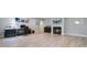 Bonus room featuring wood-look floors, a fireplace, a work area, and plenty of space for entertainment at 1014 Bradbury Ln, Charleston, SC 29492