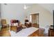 Cozy bonus room with hardwood floors, ceiling fan, and two leather reclining chairs at 1014 Bradbury Ln, Charleston, SC 29492
