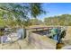 Dock featuring boat, paddleboards, and a built-in bench, a perfect spot for waterside enjoyment at 1014 Bradbury Ln, Charleston, SC 29492