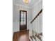 Elegant entryway featuring hardwood floors, staircase, and a glass-paneled front door at 1014 Bradbury Ln, Charleston, SC 29492