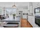Spacious kitchen features modern appliances, an island, and an adjacent dining area at 1014 Bradbury Ln, Charleston, SC 29492