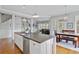Bright kitchen island with a sink and stainless dishwasher, adjacent to dining area at 1014 Bradbury Ln, Charleston, SC 29492