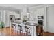 Bright kitchen features a large center island, stainless appliances, and hardwood floors at 1014 Bradbury Ln, Charleston, SC 29492