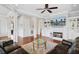 Bright and airy living room with a fireplace, built-in bookshelves, and hardwood floors at 1014 Bradbury Ln, Charleston, SC 29492
