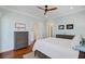 Comfortable main bedroom with light blue walls, wood floors, ceiling fan, and two dressers for ample storage at 1014 Bradbury Ln, Charleston, SC 29492