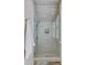 Modern walk-in shower enclosed in clear glass with horizontal tile surround and built-in shelving at 1014 Bradbury Ln, Charleston, SC 29492