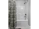 Clean and bright bathroom shower and tub combo with decorative patterned shower curtain at 1025 Riverland Woods Pl # 609, Charleston, SC 29412