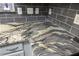 Beautiful countertop with unique marbled pattern, gray cabinets, subway tile, and modern outlets at 1025 Riverland Woods Pl # 609, Charleston, SC 29412