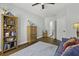 Bright room with hardwood floors, ceiling fan, patriotic accents, and comfortable blue couch at 1025 Riverland Woods Pl # 609, Charleston, SC 29412