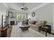 Cozy living room with fireplace, ceiling fan, plush rug and access to a private balcony at 1025 Riverland Woods Pl # 609, Charleston, SC 29412