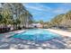 Outdoor pool with palm trees and clear blue water on a sunny day at 1025 Riverland Woods Pl # 609, Charleston, SC 29412