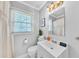 Bathroom with white vanity, good lighting, neutral tile, and functional layout at 1077 Harbor View Rd, Charleston, SC 29412