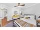 Cozy bedroom featuring hardwood floors, neutral paint, and natural light at 1077 Harbor View Rd, Charleston, SC 29412