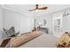 Cozy bedroom featuring hardwood floors, walk-in closet, and ensuite bath at 1077 Harbor View Rd, Charleston, SC 29412