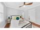 Comfortable bedroom with modern ceiling fan, light grey walls, and natural light from the window at 1077 Harbor View Rd, Charleston, SC 29412