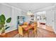 Dining room featuring hardwood floors, modern lighting, and stylish decor at 1077 Harbor View Rd, Charleston, SC 29412