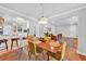 Open dining area flowing into living room, featuring stylish décor at 1077 Harbor View Rd, Charleston, SC 29412