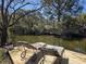 Scenic view from a waterfront dock with lounge chairs for outdoor enjoyment at 1077 Harbor View Rd, Charleston, SC 29412