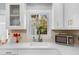 Bright kitchen features white countertops, cabinets, and stainless steel microwave at 1077 Harbor View Rd, Charleston, SC 29412