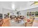 Spacious living room featuring hardwood floors, large windows, and comfortable seating at 1077 Harbor View Rd, Charleston, SC 29412