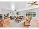 Bright living room with hardwood floors, neutral paint, comfortable seating, and large windows at 1077 Harbor View Rd, Charleston, SC 29412