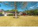 Large backyard featuring a lawn, trees, and an outdoor patio at 115 Clubhouse Rd, Summerville, SC 29483